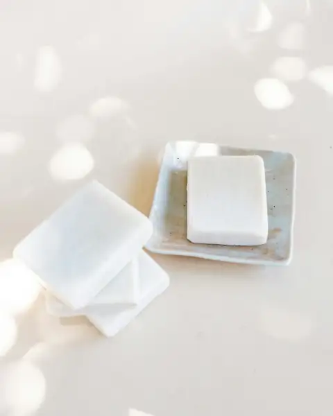 Bathroom accessories: white plastic egg tray on white table