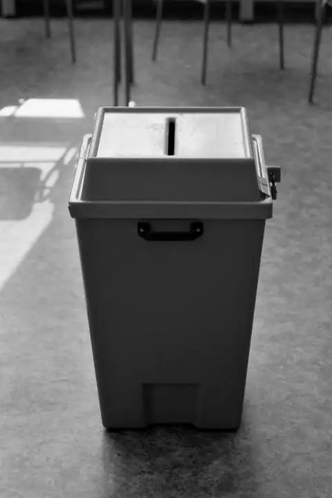 Dustbins: a black and white photo of a trash can