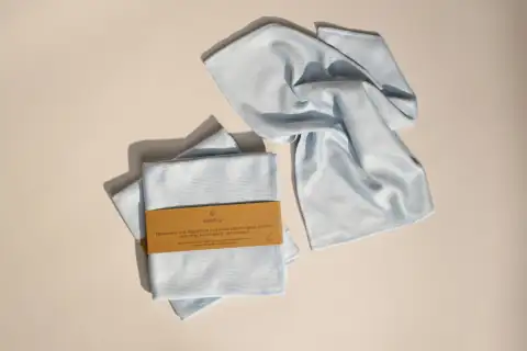 Dusters: a folded shirt with a tag