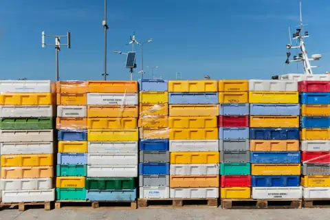 Tubs & tokna: pile of assorted-color plastic crates