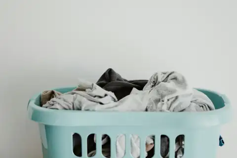 Baskets: white textile on blue plastic laundry basket