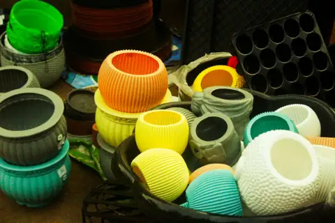 Planters & gamla: Assortment of colorful plant pots and seedling trays