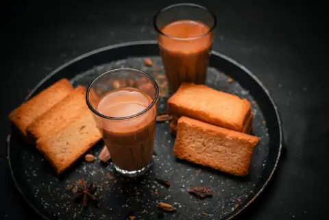 Mugs, cups & glasses: a plate of food that includes bread and a drink