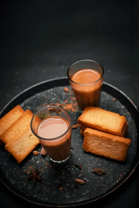 Mugs, cups & glasses: a plate of food that includes bread and drinks