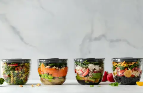 Containers & jars: four clear plastic bowls with vegetables