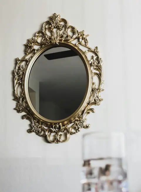 Mirrors: gold floral frame on white textile