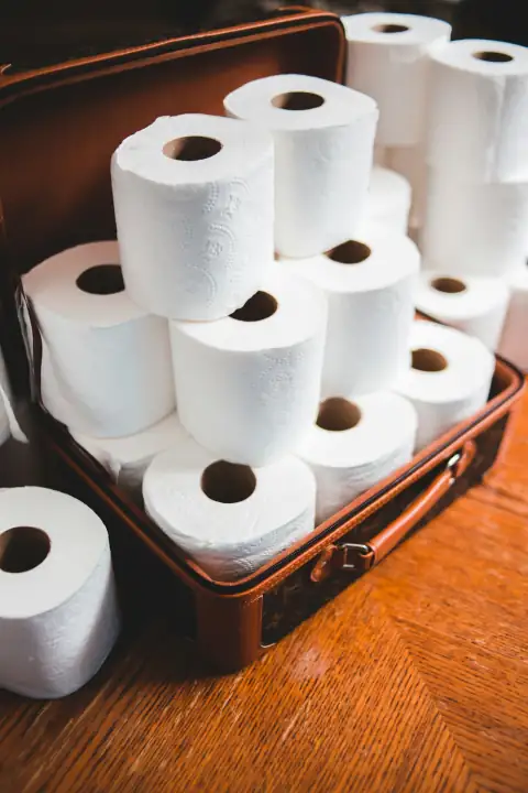 Tissue paper: white toilet paper roll on brown wooden table