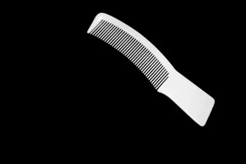 Combs & grooming: a knife with a black background