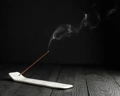 Pooja items: white handled knife on white textile