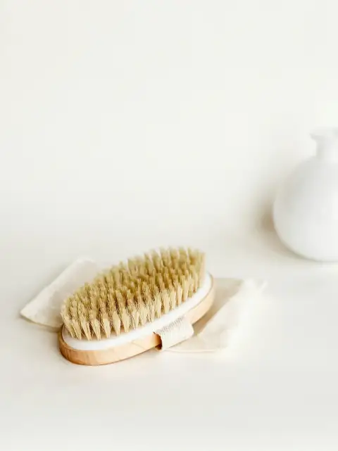 Cloth brushes: white ceramic teapot on white textile