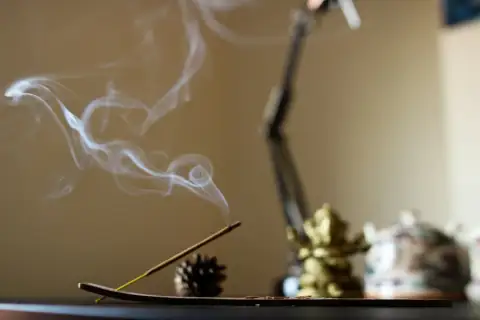Pooja items: lighted incense