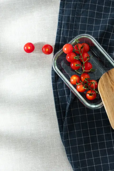 Roti rumal & napkins: a bowl of cherry tomatoes