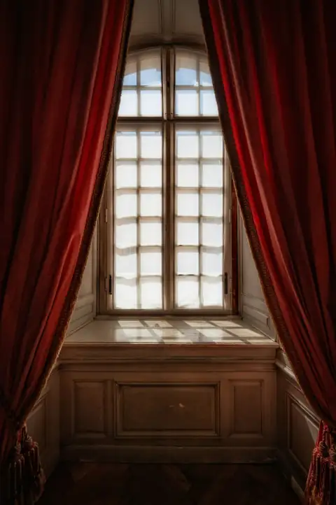 Curtains: a window with red curtains