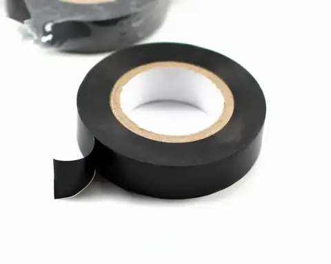 Tapes: Roll of black electrical tape on white background
