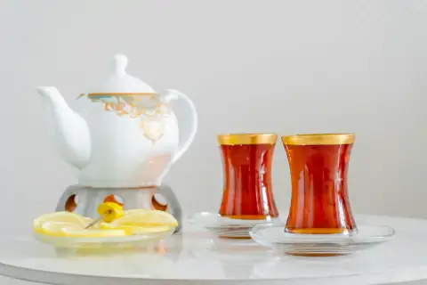 Mugs, cups & glasses: Tea set with two glasses and lemon slice