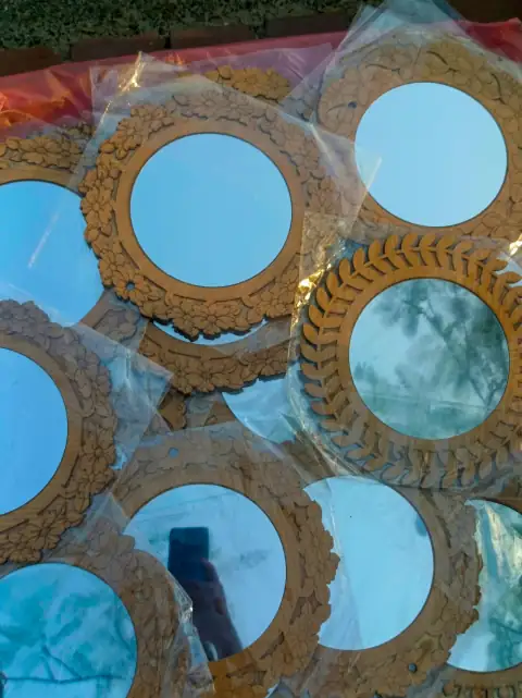 Mirror wall stickers: Multiple round mirrors with ornate wooden frames wrapped in plastic